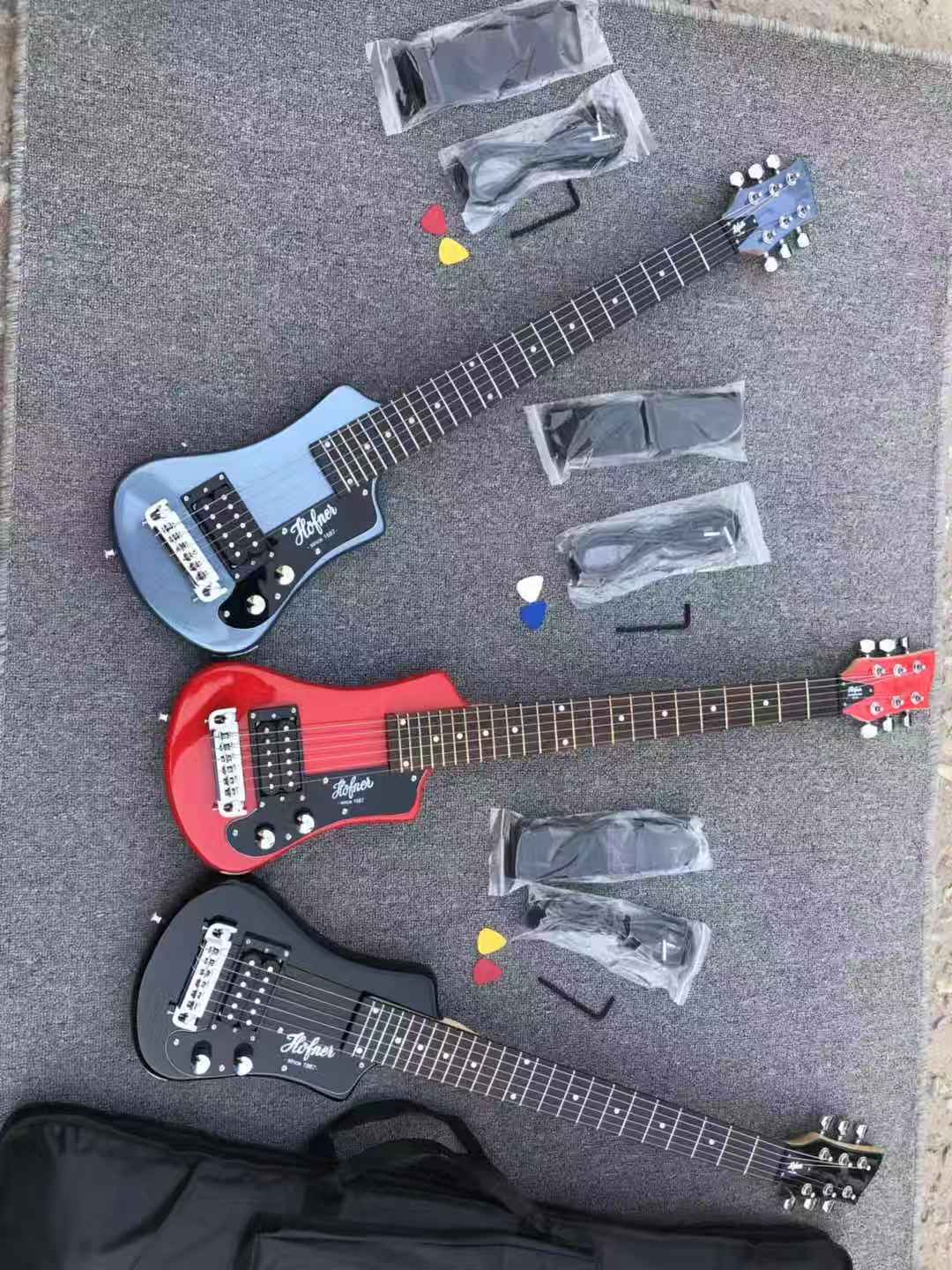

Promotion Black / Red /Metallic Blue Hofner Shorty Travel Guitar Protable Mini Electric guitar With Cotton Gig Bag, Wrap Arround Tailpiece