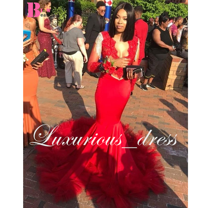 long dress with feathers at bottom