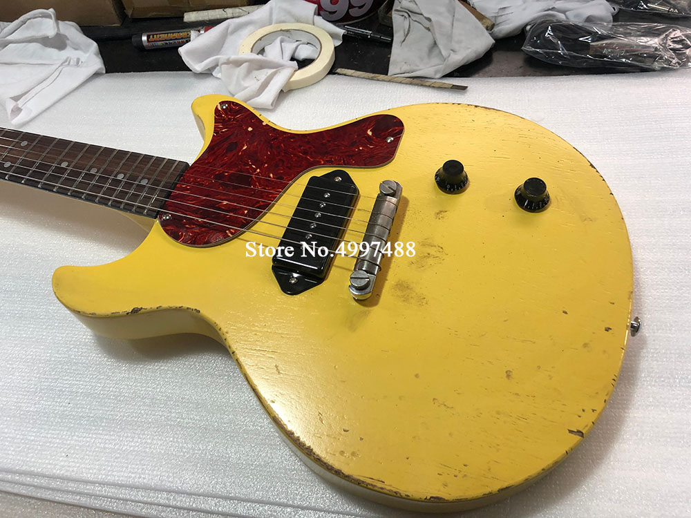 

1959 Junior DC TV Yellow Cream Relic Electric Guitar, Black P90 Dog Ear Singlecoil Pickup, Red Turtle Shell Pickguard, Wrap Around Tailpiece