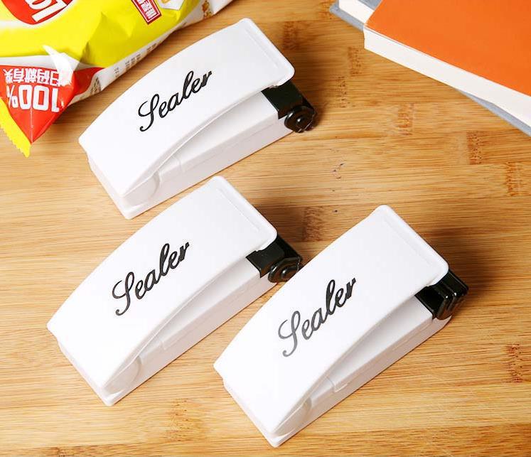 

New 209 Mini Handle Bag Sealer Electronic Home Heat Sealing Machine Vacuum Impulse Sealer Seal Packing Plastic Bag Clips Kitchen Tools