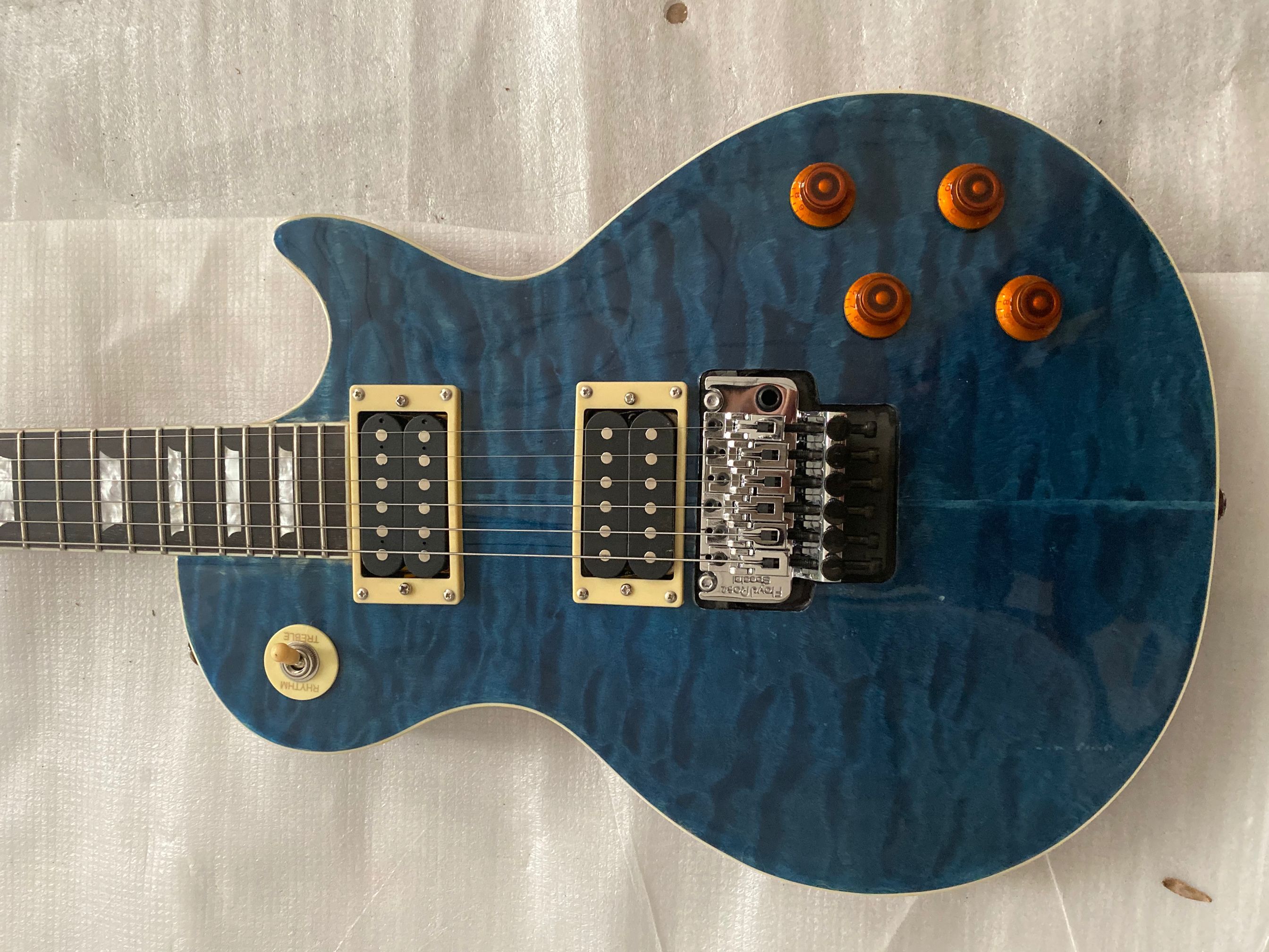 

Alex Lifeson Blue Quilted Maple Top Electric Guitar Axcess Carved Neck Joint Floyd Rose Tremolo Bridge, Belly Cut Contour, Chrome Hardware, In stock