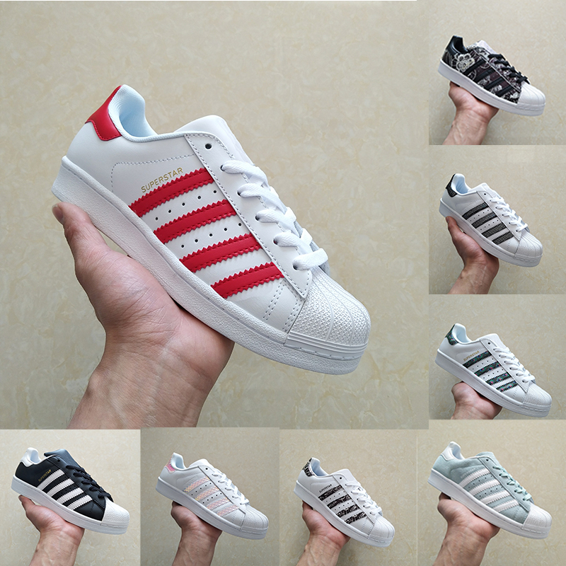 white sneakers with gold stars