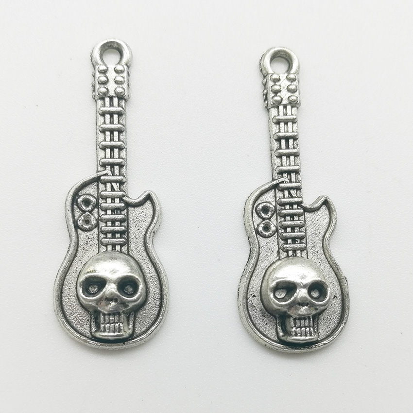 

100pcs Ghost Head Guitar Charms Pendants Retro Jewelry Accessories DIY Antique silver Pendant For Bracelet Earrings Keychain 32x11mm
