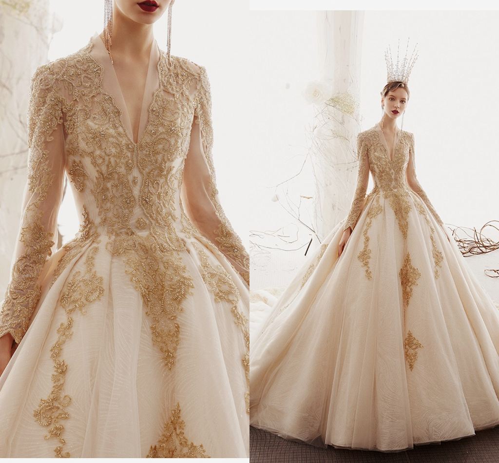 

New Arrival Long Sleeves Gold Appliqued A-line Wedding Dresses Dubai Arabic Luxury Beaded V Neck Sweep Train Bridal Gown, Champagne