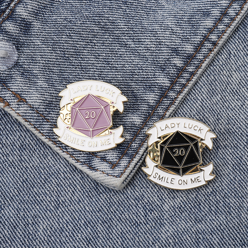 

Geometric triangle stitching 20 face dice Surround ribbon Enamel brooch The slogan "LADY LUCK SMILE ON ME" Black purple badge