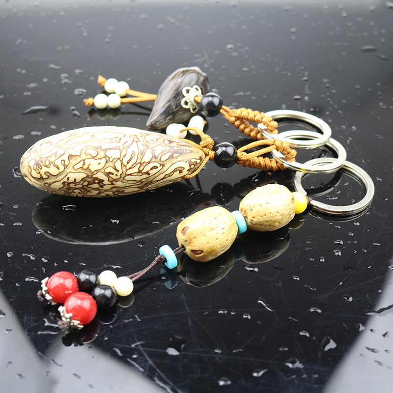 

Fruit keychain thousand eyes Bodhi keychain original seed keychain selection large white seed high-end car key chain
