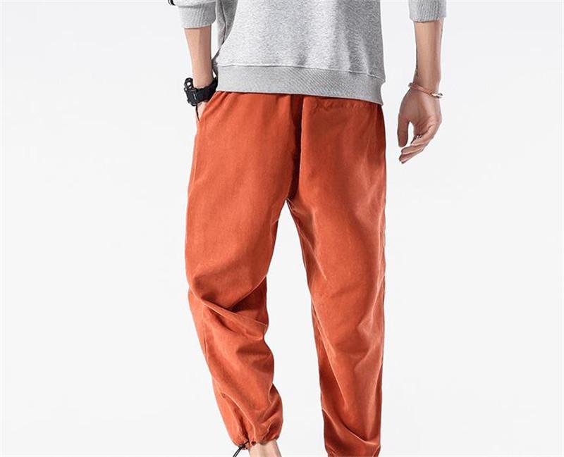 orange track pants