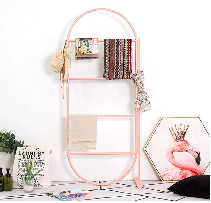 Golden clothing display rack against wall Children Furniture Simple floor-mounted hat shelf creative decorative scarf racks-image-480155623