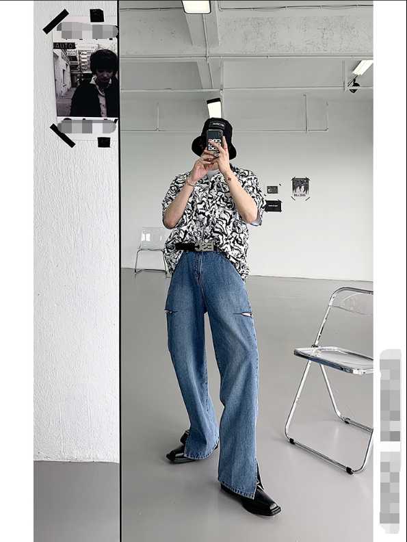 

A pair of ripped and slit jeans that are very stylish for men in 2020, Blue
