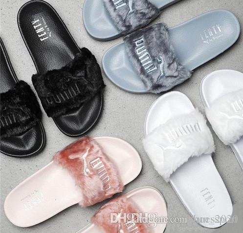 black fluffy puma slides