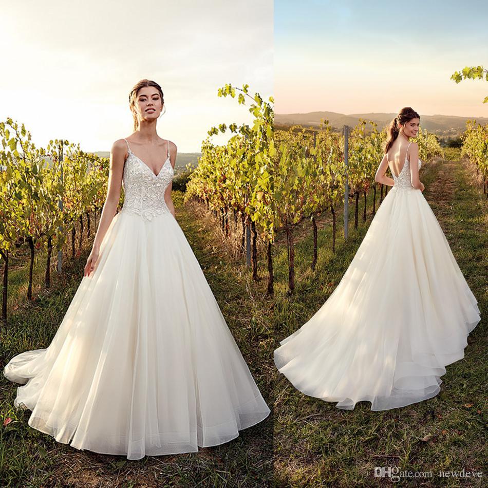 

Eddy K 2019 Garden Wedding Dresses Spaghetti Straps Backless Lace Appliques Beach Bridal Gowns Sweep Train Country A-Line Wedding Dress, Champagne
