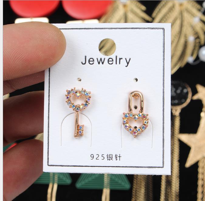 argent Version cor/éenne simple mode nouvelles boucles doreilles asym/étriques femmes longue oreille g/éom/étrique transfrontali/ère ongles or argent