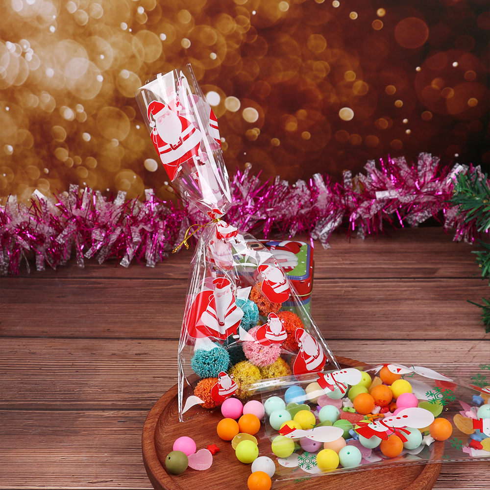 

50pcs Plastic Bag Christmas Candy Bags Transparent Baking Packing Bag Cellophane Santa Claus Snowman Christmas Party Favor Gift