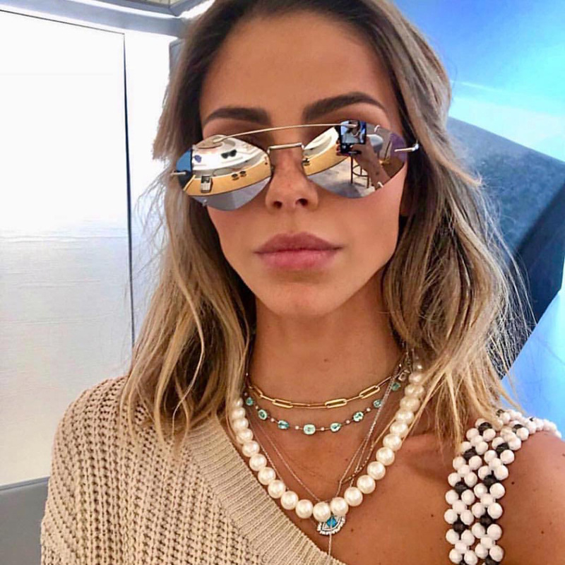 

Wholesale- designer luxury frameless polygon sunglasses men and women tide Europe and America street shooting ultra light sunglasses