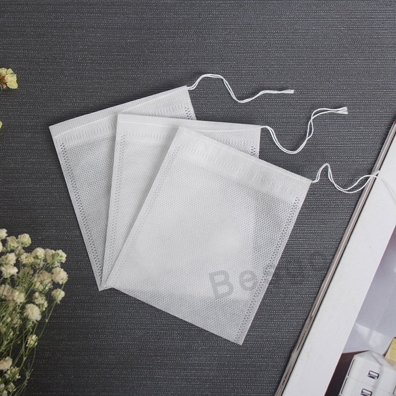 

100Pcs/lot 60x80mm Teabags Tools Non Woven Drawstring Empty Scented Spice Bags Heal Seal Filter Bag Herb Loose Tea Leaves Strainer DBC BH2725