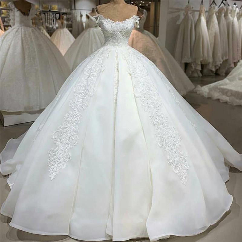 

Luxury Lace Ball Gown Wedding Dresses Sexy Backless Off The Shoulder Appliques Sweep Train Ivory Princess Bridal Dress voiles de mariage, White