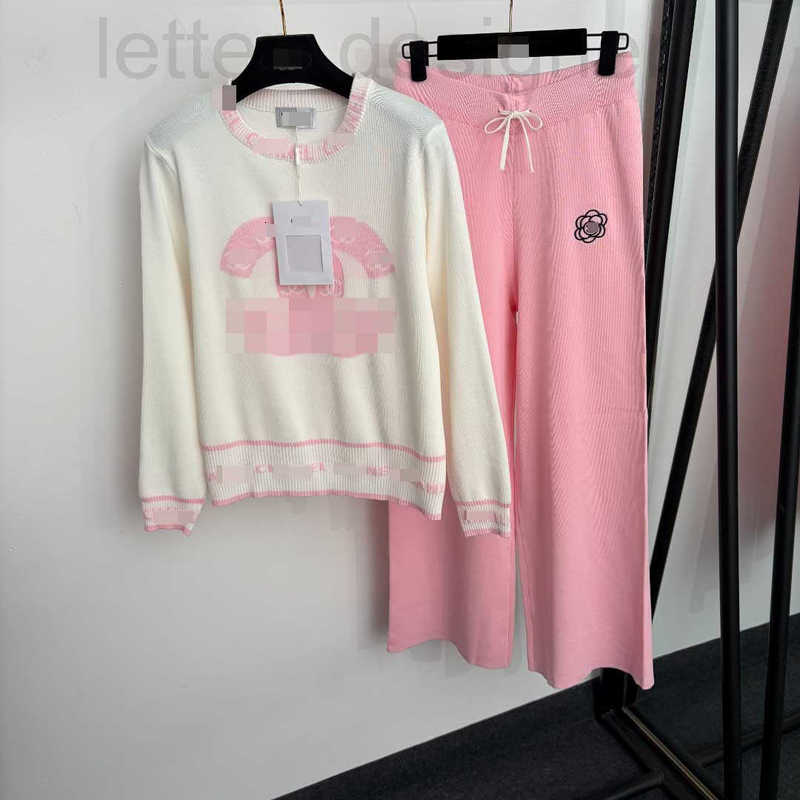 Designer Women's Two Piece Pants New collection stylish set featuring a long-sleeved knit top and high-waisted knit pants with camellia embroid
