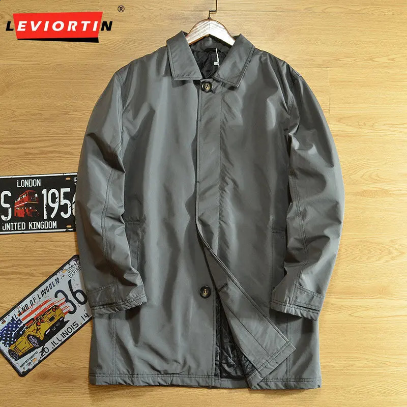 Winter men's British style windproof waterproof clip on cotton warm and versatile solid color medium to long windbreaker jacket 260916