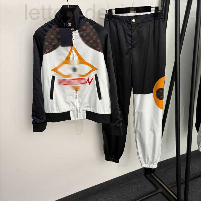 Designer Women's Two Piece Pants sports suit with a monogrammed four-leaf clover print, featuring color-blocked long-sleeved zip-up jacket and