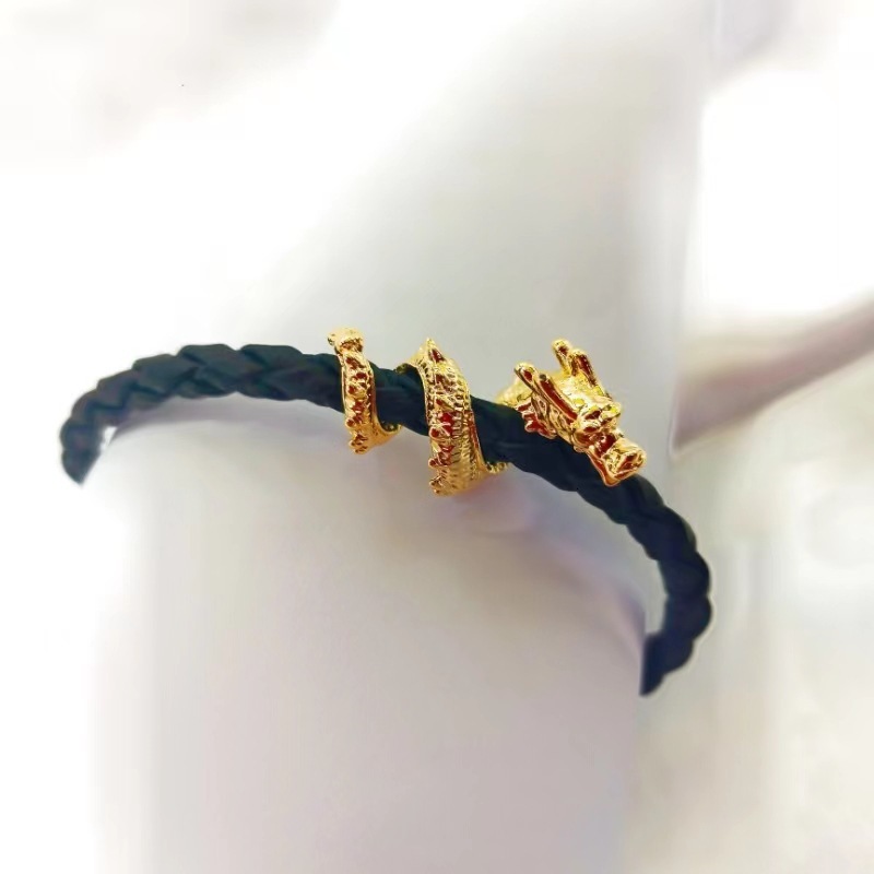 New Dragon in Sky bracelet, popular item for Year of the Dragon, featuring coiled dragon design, leather cord, and a lucky koi fish charm