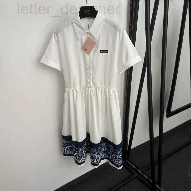 Designer Basic & Casual Dresses style shirt dress with letter on the collar, cashew flower print on the hem, and a tie-waist design
