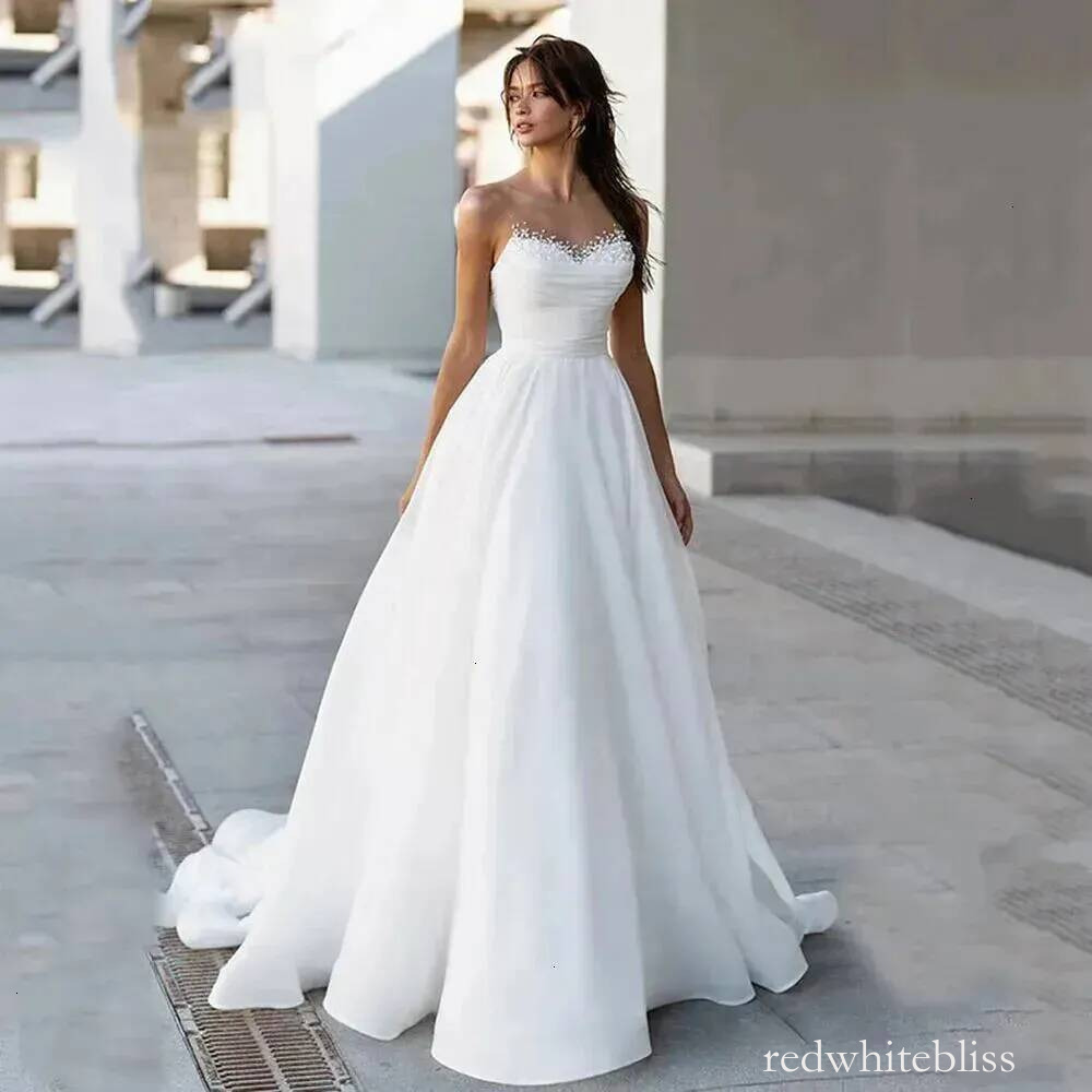 New White A Line Wedding Dress Sheer Neck Sleeveless Beads Boho Beach Bride Gowns Simple Designed Robe De Mariage