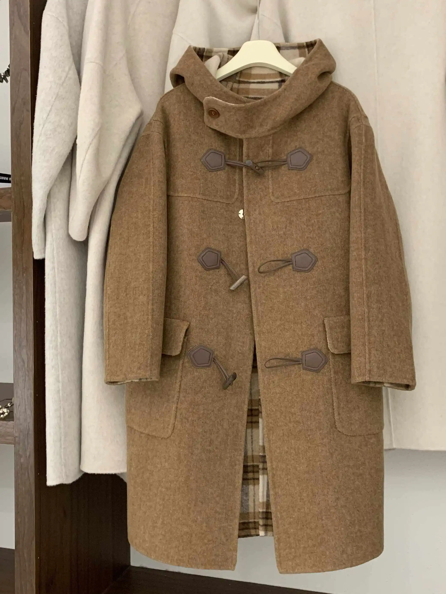Retro Cow Horn Button Hooded DoubleSided Cashmere Coat For Women In Autumn And Winter 2025 Korean Loose Medium Length Jack 260917