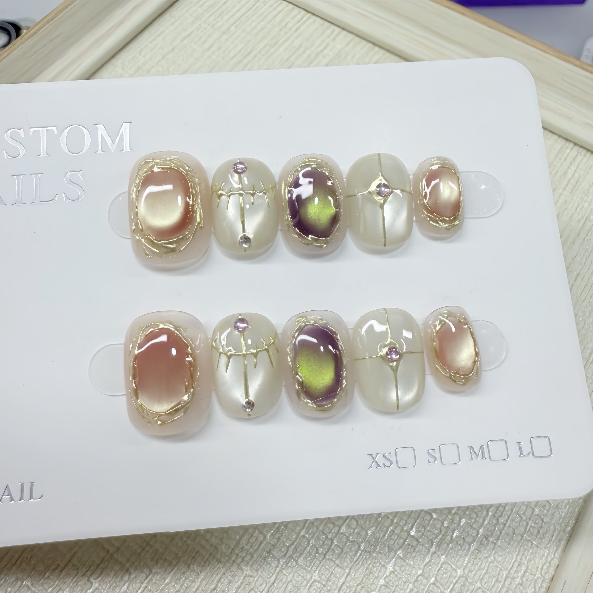 Athena's handcrafted wearable nails with gemstone embossing, cat-eye effect, niche phototherapy nails, magic mirror powder, light luxury and el
