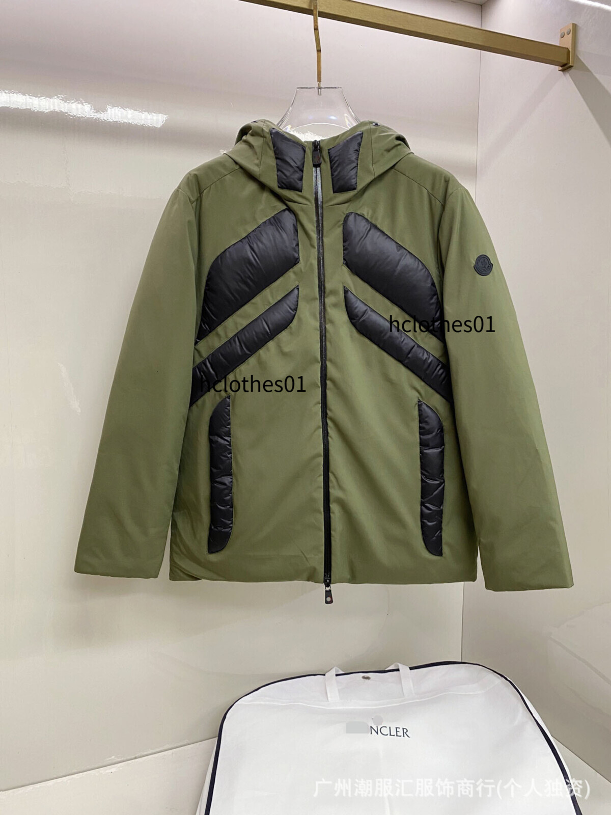 M brand men's hooded down jacket with contrasting shiny fabric, quilted back, printed sleeves, and a warm, casual design