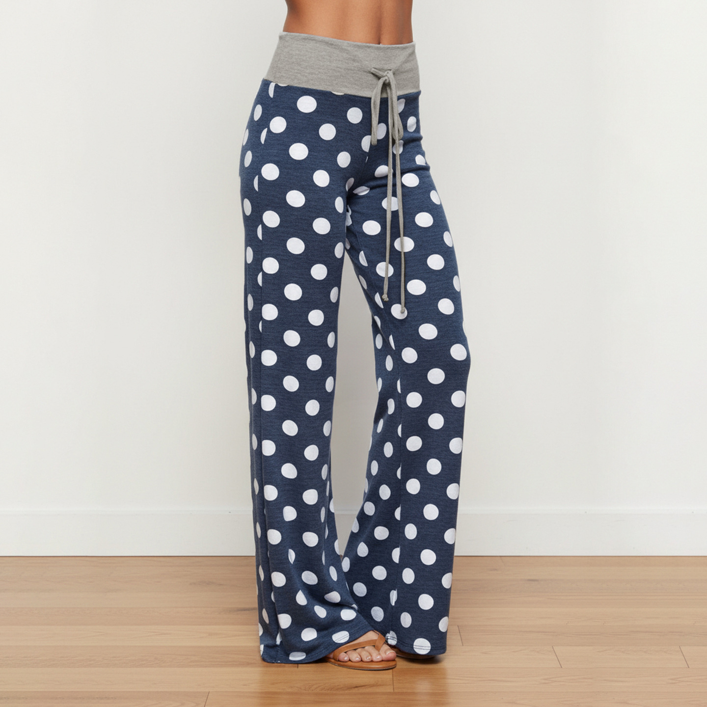 American-style, relaxed-fit casual long pants with a polka dot print, contrasting colors, drawstring waist, loose straight-leg design, comfortable f