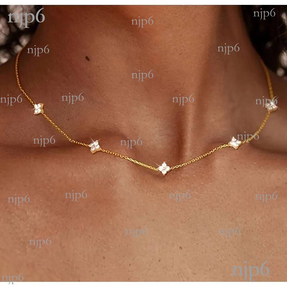 Four-Leaf Clover Necklace Designer For Women Adorned with Tiny Sparkling Gems Elegant Stardust Design