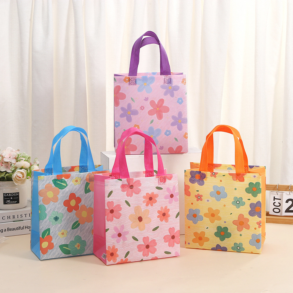 Crossborder nonwoven simple stylish tote portable handheld waterproof shopping and packaging bags, printed gift bags