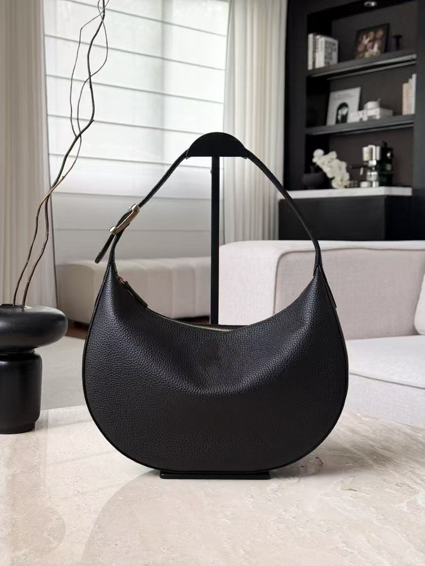 New versatile shoulder bag, classic crescent shape; effortless and casual underarm style.
