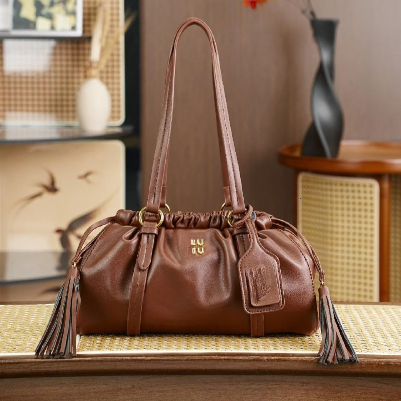 Mieumieubag Designer Bags 2026 Trends Vintage Tassel Drawstring Saddle Bag For Women High End Single Shoulder Underarm Versatile Commuting Tote Clou