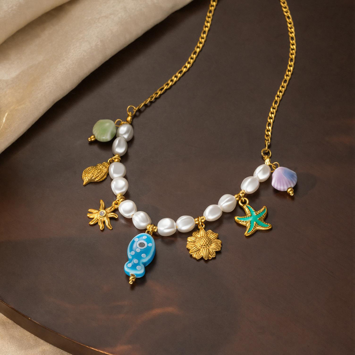 French-style vacation-inspired ocean necklace: 18K gold stainless steel with starfish, shell, and pearl pendants, a unique clavicle chain necklace