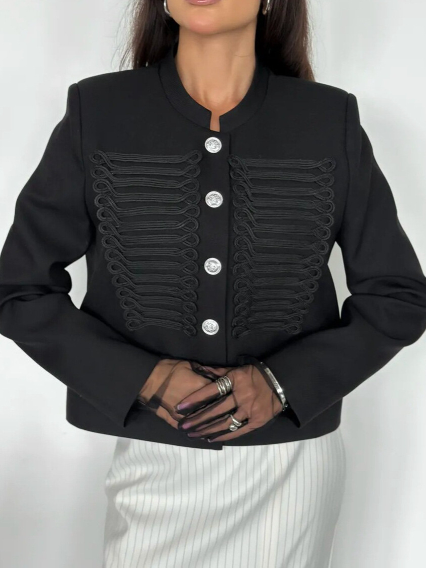 Elegant refined, this new top features classic, court-style design with stand-up collar, metal buttons, and fitted silhouette, making it a luxurious