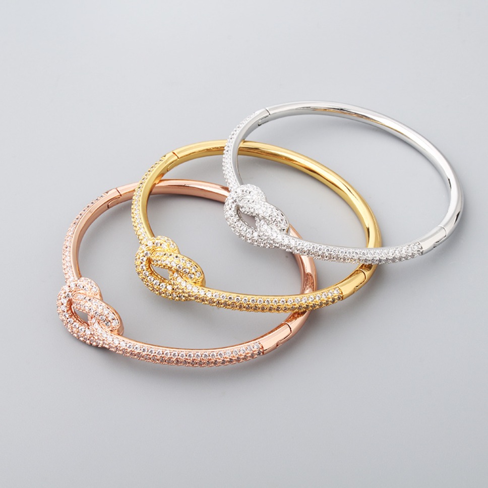 Designer Gold Plated Knot Bangle Inlaid Clear Rhinestone Elegant Womens Statement Jewelry for Wedding Anniversary Daily Wear...