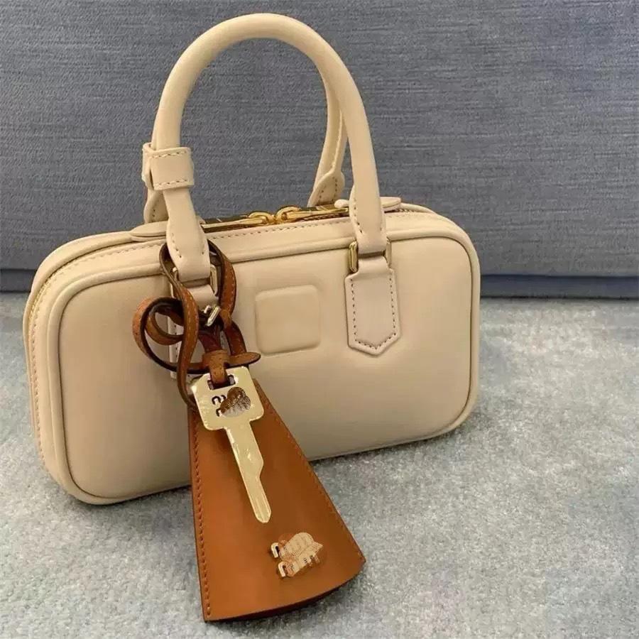 Luxurious and fashionable keychain Senior designer creates accessories for luxury bags Lady's gift Leather manufacturing Recessed letters