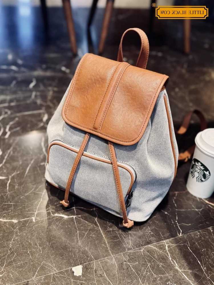 Style 2026 Womens Genuine Backpack Leather Patchwork Canvas Backpack New Style Female Fashion Travel Bags Drawstring Casual Backpacks Hot Sale H2609