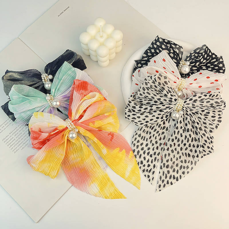 New pearl-embellished crinkled chiffon spring clip with bow featuring a gradient tie-dye design in an Instagram-inspired style perfect for girls to