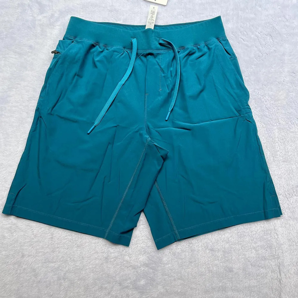 Abbigliamento da yoga elasticizzato Pantaloncini da corsa sportivi da uomo Pantaloni ad asciugatura rapida Cerniera posteriore Tasca morbida e trasp