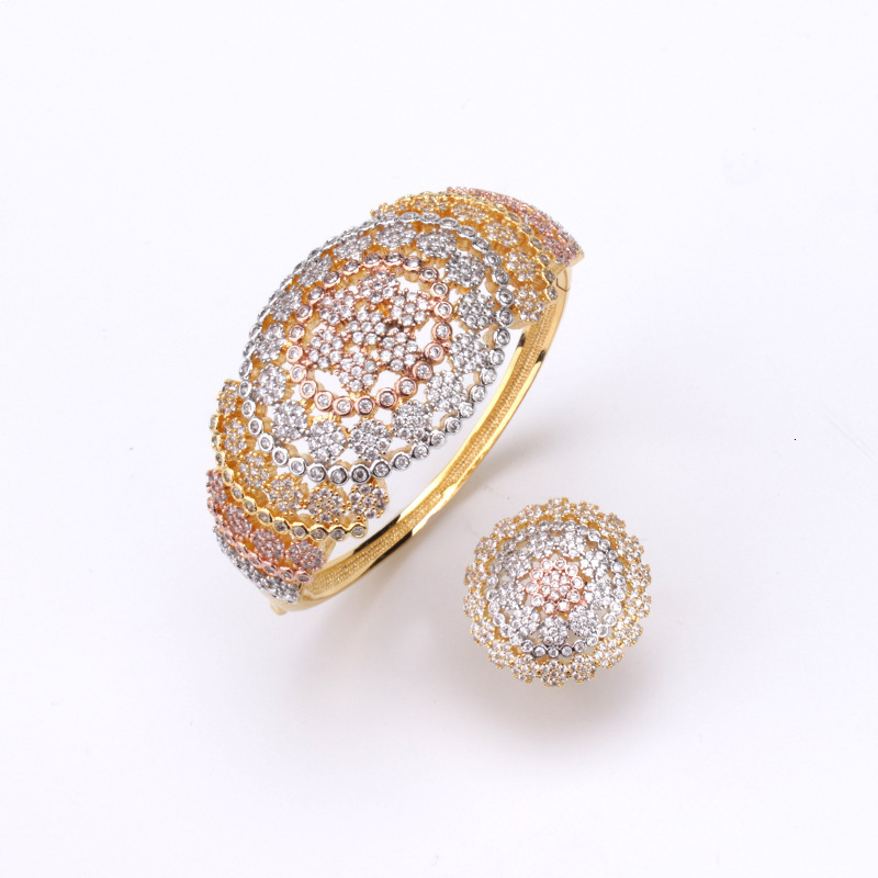 A stylish and elegant set of bracelet and ring featuring olive-shaped floral designs, fully encrusted cubic zirconia, and featuring a hollowed-out d