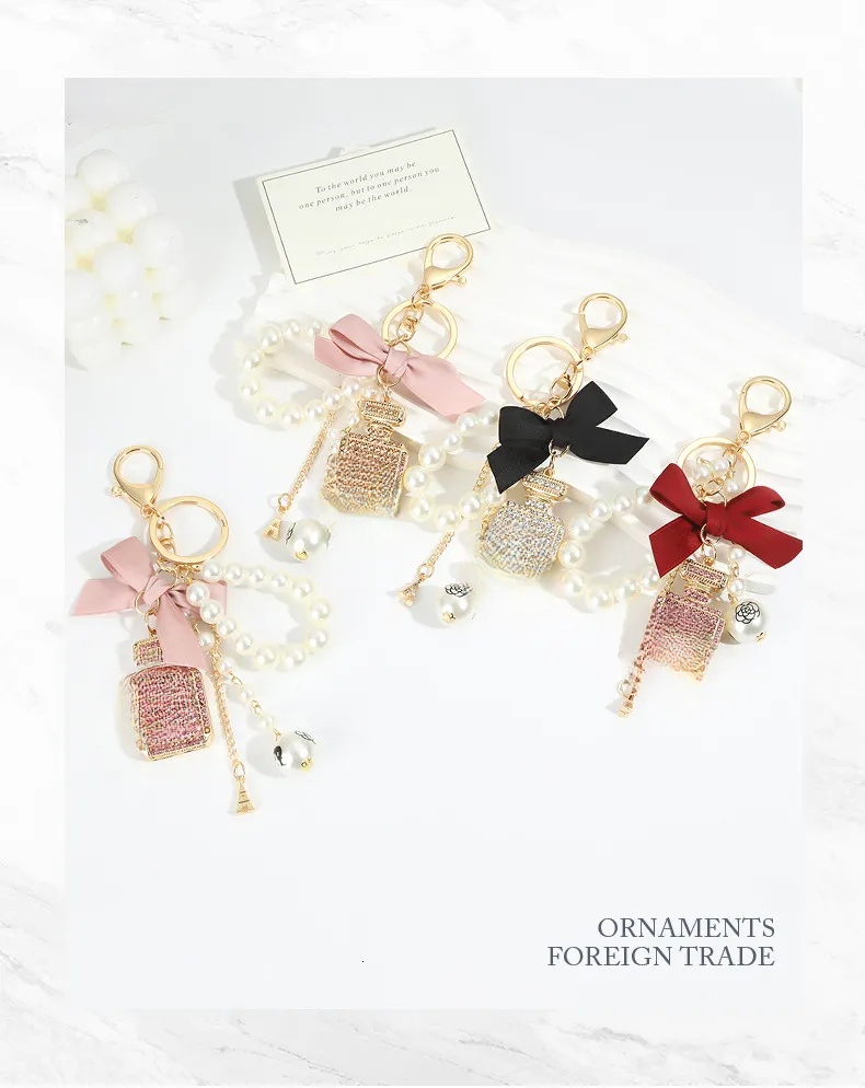 2026 New Keychains Bow Knot Imitation Pearl Perfume Crystal Bottle Iron Tower Chain Keychain Car Key Ring Bag Charm Accessories Girl perfume Keyring