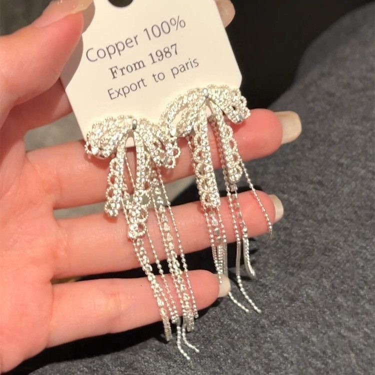 Korean-style ballet-inspired lace bow tassel earrings, a delicate luxurious accessory that exudes elegance and sophistication