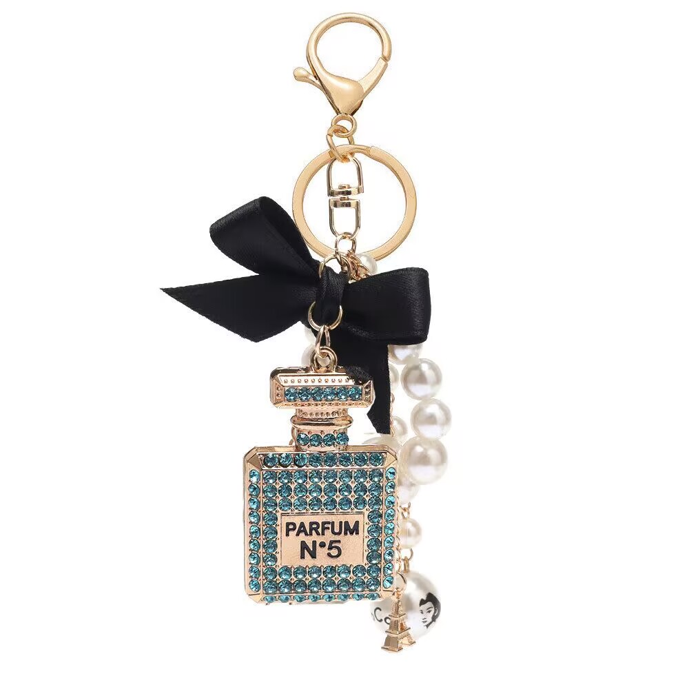 Designer lanyard alloy diamond inlaid bow shaped perfume bottle creative pearl chain pendant bag export key chain