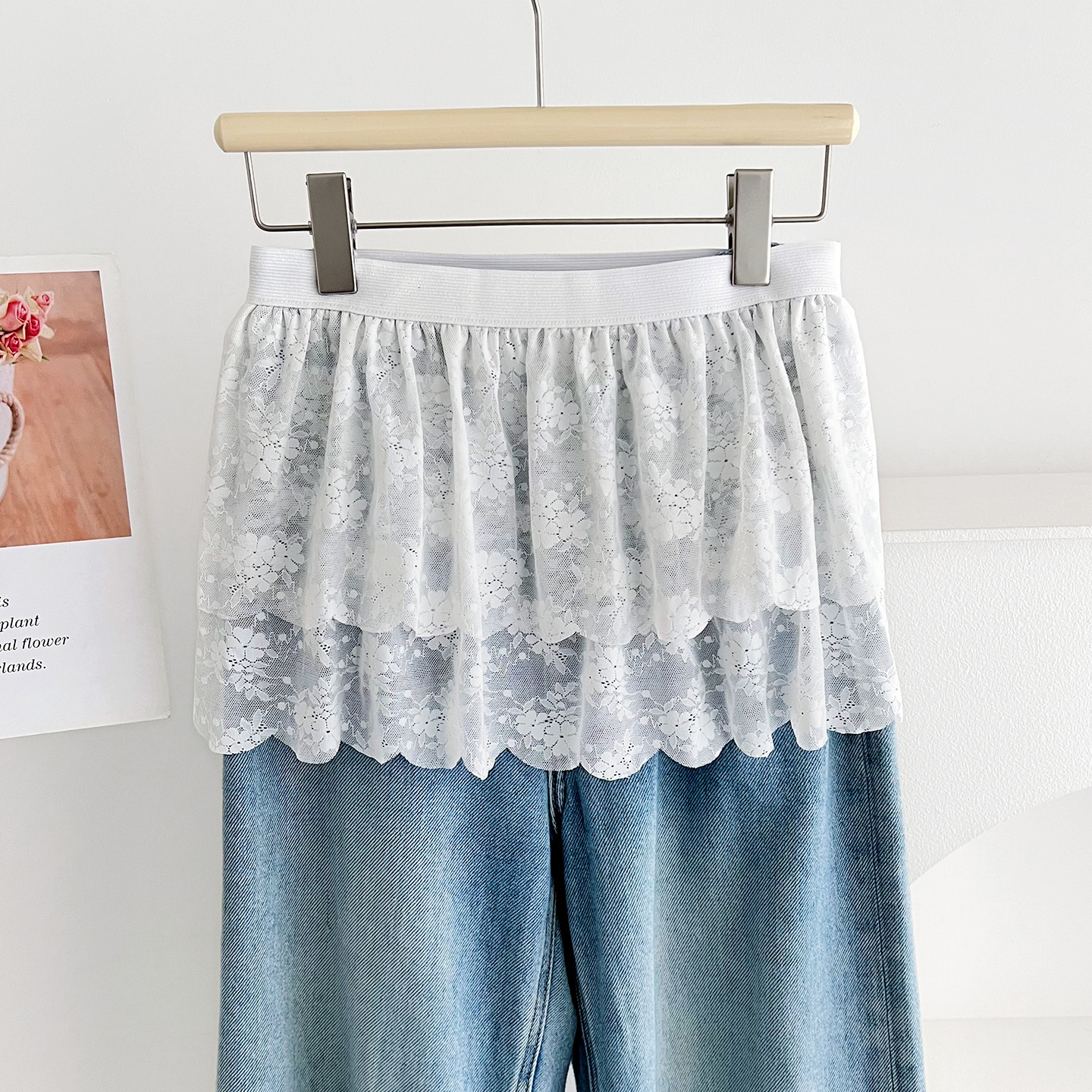 New French-style white lace skirt women, perfect for summer layering, with sophisticated design, tie-up detail, and slimming effect, creating a flat