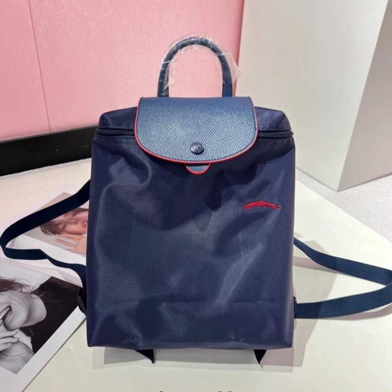 Designer bag A men's and women's double shoulder bag in 2026 new style Waterproof nylon lightweight commuter backpack Simple and versatile