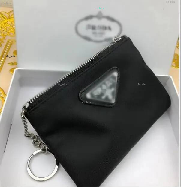 Pochette en nylon noir élégant Mini portefeuilles Titulaire de la carte Charme de sac de créateur Porte-monnaie en toile avec logo de charme Port