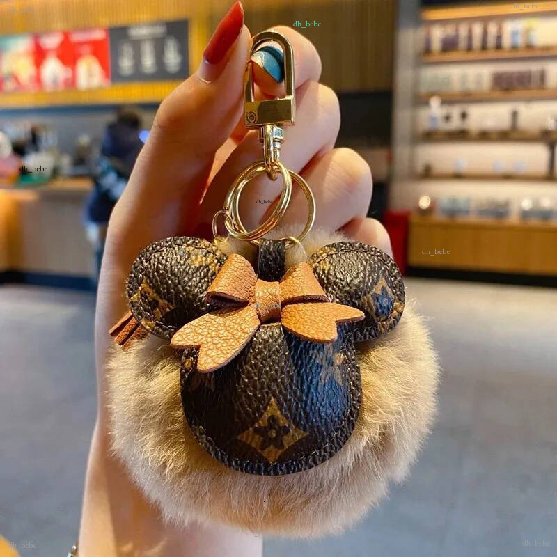 Porte-clés unisexe anneaux accessoires Pom pom fleur PU cuir voiture porte-clés boucle bijoux de mode sac cadeau breloques pendentif porte-clés