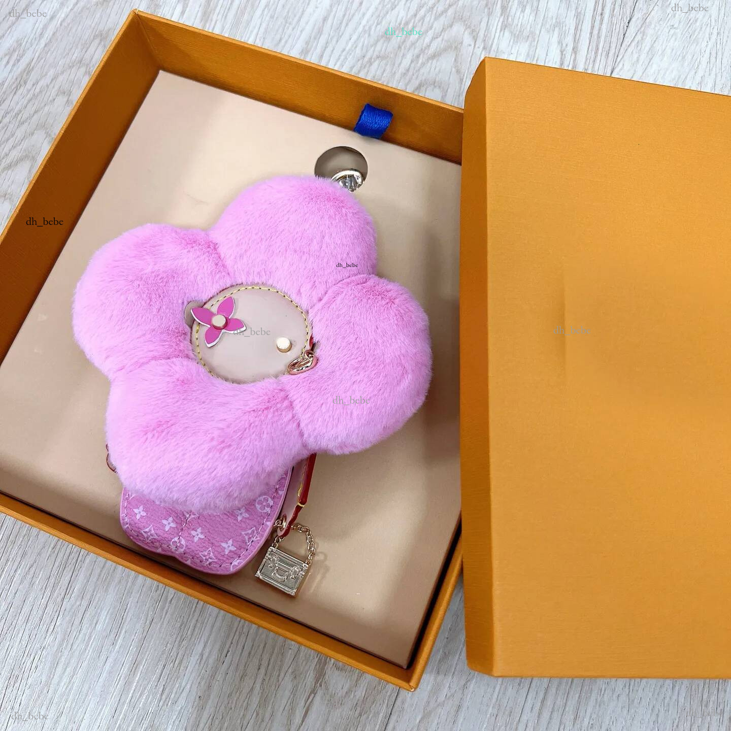 Porte-clés de styliste de luxe en cuir de tournesol, breloques pour sac, pendentif, porte-clés pour hommes et femmes, bijoux à la mode, cadeaux p